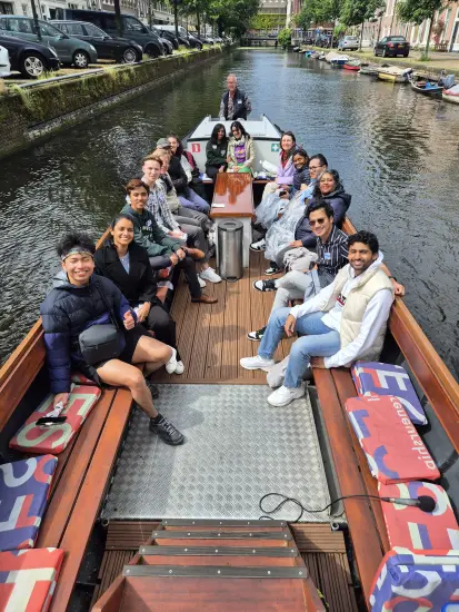 A group of students sitting in a boat during Erasmus by the Sea.