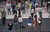 City scenen of people outside walking down steps