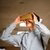 Boy holding AR/VR device up to his face