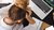 Frustated person with their head down and hands on their head looking at a laptop