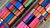 Helicopter view of an array of different colour containers on a cargo ship