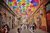 Street with colourful umbrellas hanging above it