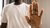 Person holding hand up 