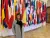 Francisca Vargas Lopes in front of flags at the OECD