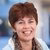 Women with brown hair smiling to the camera