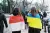 People with Polish and Ukrainian flags