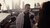 Robby Roks being interviewed by podcast makers in front of the Erasmus Bridge in Rotterdam