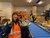 EUR employee smiles at the camera while holding a chicory in her hand.