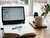 Laptop, notebook and a cup