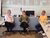 Three people talking.