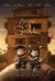 movie poster of memoir of a snail. two claymation figures sitting in front of a brown building, both reading a book