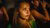 Girl in a crowd looking away