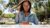 A young woman is using the Libby app on her phone 