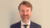 Associate Professor Aart Gerritsen against a beige background