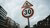Red and White road signs under gloomy sky