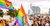 Group of participants during Pride March in Rotterdam with all kinds of (rainbow) flags