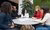 People are sitting around a table.