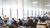 A big open workspace with people working behind desks
