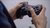 Person is holding a controller for a gaming console