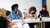A group of diverse students are very focused and working on a project
