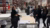 A large warehouse with people waling around