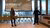 Two people standing in front of a presentation screen
