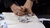 A designer sketching with a fineliner on a piece of paper