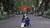 Photo of Xiaoyu Zhang sitting in a street