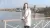 Photo of Xiaoyu Zhang standing on a bridge