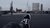 person sitting next to the Maas river