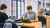 students studying behind laptop at location Erasmus University College