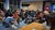 Students sitting in a room and talking to each other