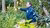 Tour guide pointing at special plant