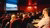 People sitting in a music theater watching a film