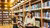 Two students exploring the bookshelves of the Leeskabinet, books in hand