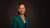 prof.dr. Jane Murray Cramm smiles into the camera wearing a green suit.