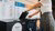 Person disposing waste in waste bin