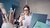 Creative person is happily checking messages on her smartphone