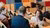 Researchers in a conference room discuss among each other. 