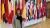 Francisca Vargas Lopes in front of flags at the OECD