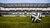 Football on grass in stadium