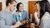 Four people having a conversation at a table
