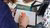 person signing paper