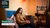 Ghostworkers girl sitting on a sofa