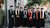 Professors outside in a group with colourful epitoga