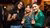 3 women looking at the camera holding drinks