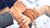 Hands holding in an office