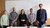 Five people stand side by side posing for the photo.