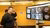 Man looks at a screen with deep fakes.