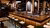 inside a cafe with a counter and a row of barstools